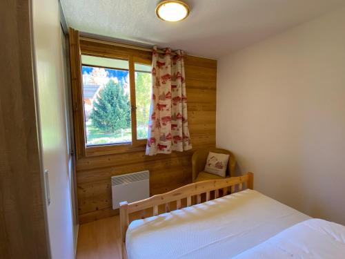 Ένα ή περισσότερα κρεβάτια σε δωμάτιο στο Appartement 4-6 personnes centre Les Contamines Montjoie