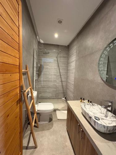 a bathroom with a toilet and a sink at Villa Sofia And Spa in Marrakech