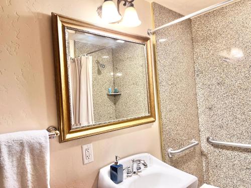 a bathroom with a sink and a mirror and a shower at Family Friendly Zermatt 2BR Villa Near Park City & Deer Valley Ski Resorts #55 57 in Mound City