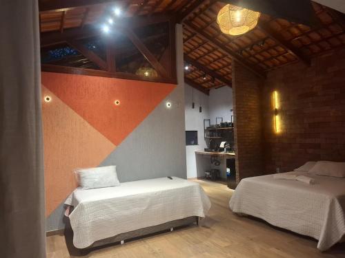 Postel nebo postele na pokoji v ubytování Vila Visgueiro - Loft com spa privativo