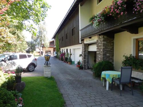 a car parked next to a building with a table at Reiserhof in Zell am Ziller