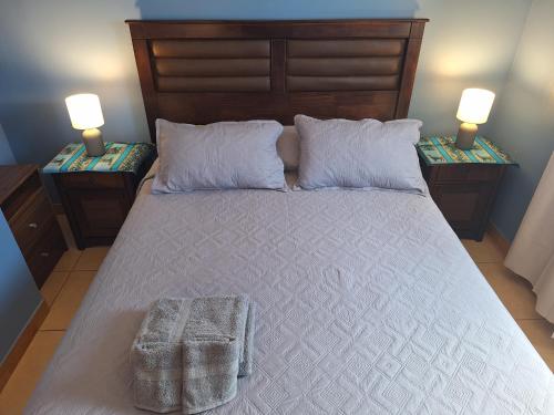 Ένα ή περισσότερα κρεβάτια σε δωμάτιο στο Casa Familiar La Rose