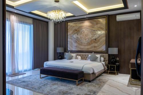 Postel nebo postele na pokoji v ubytování Jowin Villa