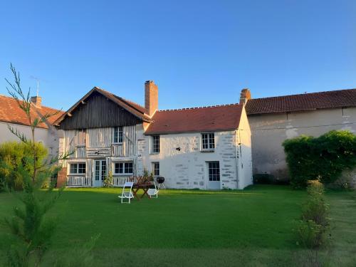 a large house with a lawn in front of it at Le Domaine de l'Ormurion in Sourdun