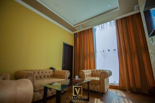 TV a/nebo společenská místnost v ubytování Viaggio Hotel