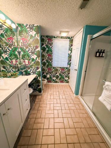 a bathroom with a shower and a sink and a toilet at Tiki Time-2BD2BAPoolsGrillPatio-Four Seasons in Lake Ozark