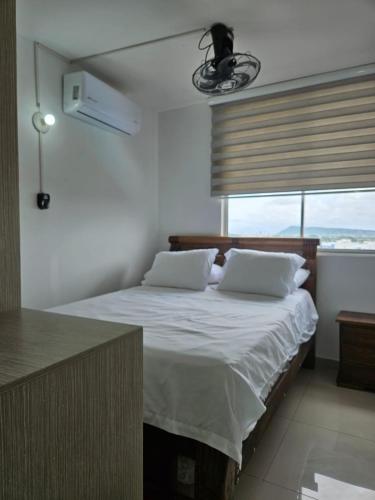 Postel nebo postele na pokoji v ubytování Apartamento Cómodo y Residencial con parqueo