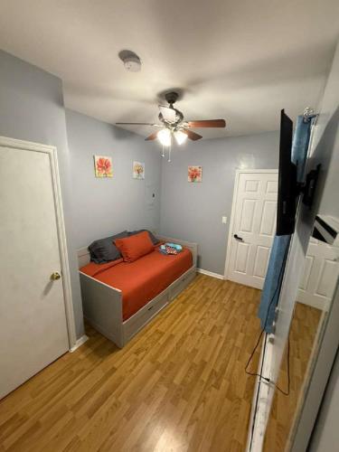 a bedroom with a bed and a ceiling fan at New 3 BR Apt in Elizabeth Railroad Style Path Train Bus Hospital EWR Airport NJ Manhattan NYC in Elizabeth