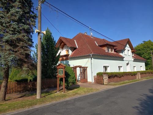 a large white house with a brown roof at Rezidence Jih in Hlavňovice