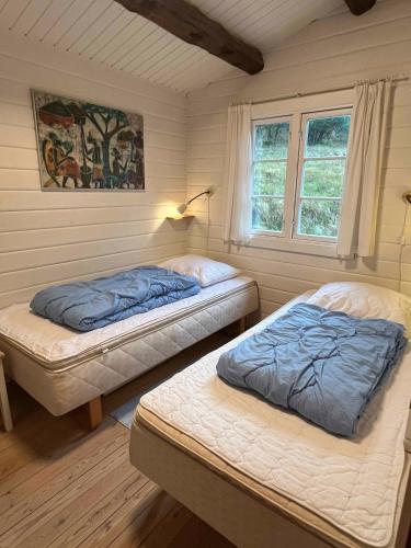 Voodi või voodid majutusasutuse Log Cabin On Fanø Near Beach And Nature toas