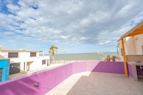 a view of the beach from the balcony of a house at Condo 5, in San Felipe Just Steps to the Beach, Near the Malecon. in San Felipe