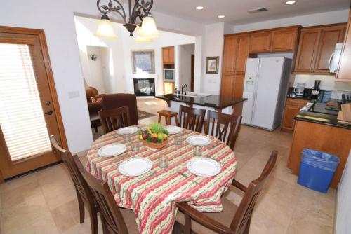 a dining room and kitchen with a table and chairs at El Dorado Ranch Vacation Rental Condo 25-1 | 18-Hole Golf in Playa El Paraíso