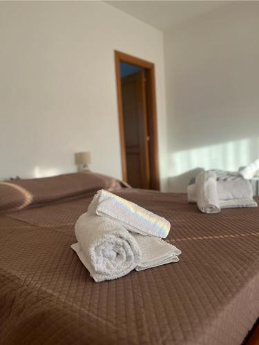 Giường trong phòng chung tại Belvedere Locanda