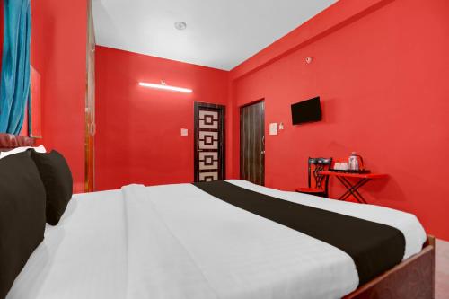 Ένα ή περισσότερα κρεβάτια σε δωμάτιο στο Hotel O Patliputra Railway Station Formerly Rameshwaram Guest House