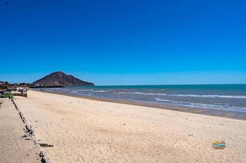 a sandy beach with a view of the ocean at InTown Beach front condo - Casey`s condo 1 in San Felipe