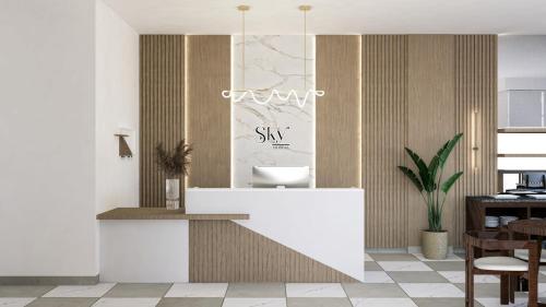 un baño con lavabo y espejo en Hotel Sky - Tarija, en Tarija