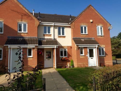 a house with red brick at Themed Cosy Home by Cannock Chase Forest in Rugeley