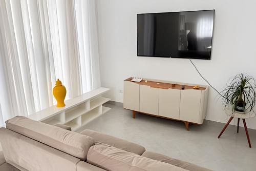 TV a/nebo společenská místnost v ubytování Lisjoy: Casa de Campo Aconchegante