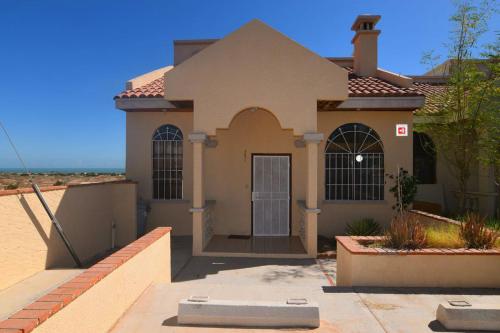 a house with a door in front of it at Casa Rubio del Mar - Monthly Rentals Welcome in San Felipe