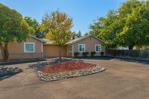 a house with a tree in the middle of a driveway at 2 bed 1 bath special woodlake B in Sacramento