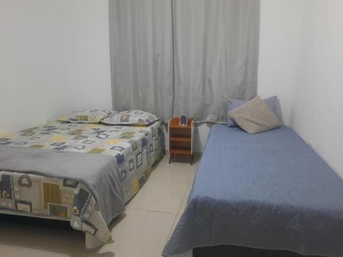 Postel nebo postele na pokoji v ubytování Aconchego de vó