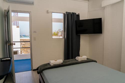 Postel nebo postele na pokoji v ubytování Hostal Elizabeth