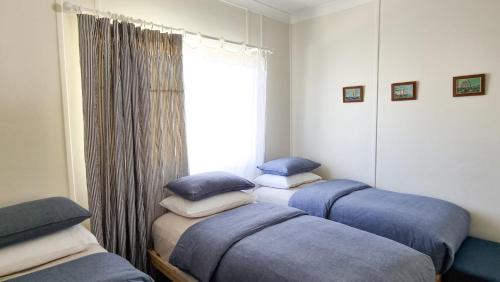 Ένα ή περισσότερα κρεβάτια σε δωμάτιο στο Harrington Holiday House