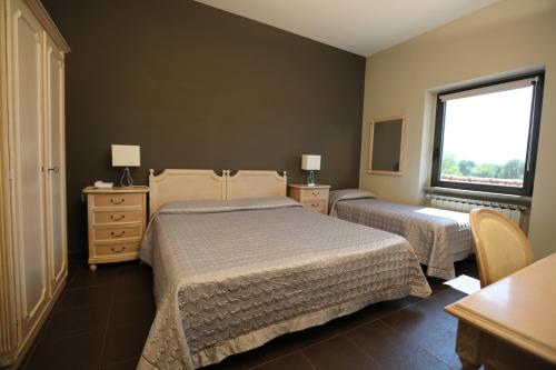 Una cama o camas en una habitación de Hotel Ristorante Borgo Antico