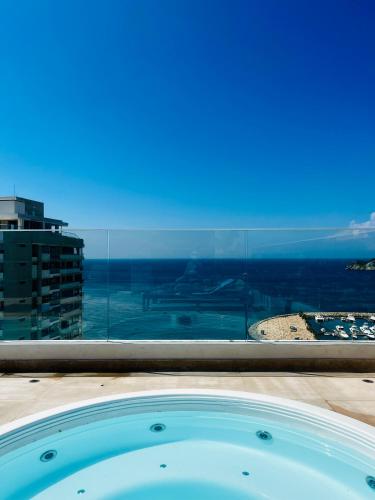 a hot tub with a view of the ocean at EIRA TACK by Tack Real Estate in Santa Marta