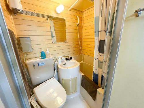 a small bathroom with a toilet and a sink at Rakuda Hotel Jinguu - Vacation STAY 97183v in Miyazaki