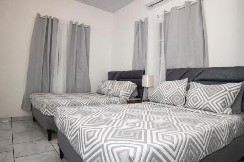 a bedroom with a bed and a couch at Coco Cabana en Playa San Diego in San Diego