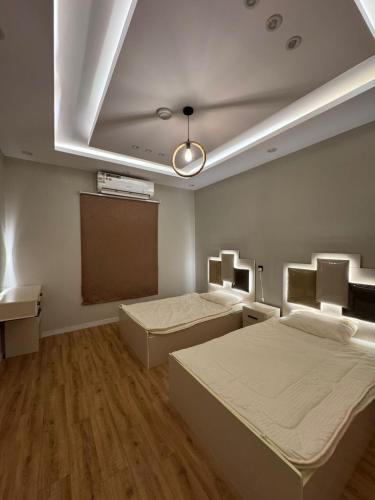 Postel nebo postele na pokoji v ubytování شقق ندى