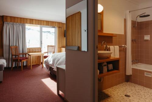 Postel nebo postele na pokoji v ubytování Eiger Chalet