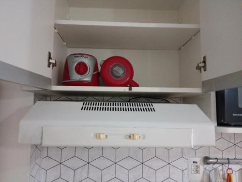 Een keuken of kitchenette bij Aconchego house