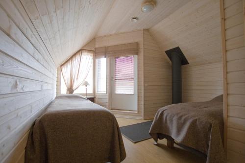Holiday Houses Saimaa Gardensにあるベッド