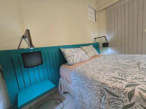 Ένα ή περισσότερα κρεβάτια σε δωμάτιο στο La baie de GOYAVE