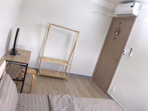 a bedroom with a mirror and a desk and a bed at Simple House-Simple Life in Long Xuyên