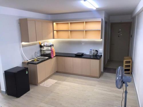 a kitchen with a sink and a counter top at Simple House-Simple Life in Long Xuyên