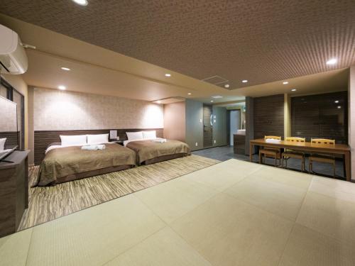 a bedroom with a bed and a desk in a room at Disney Style Hotel "J Hotel" - Vacation STAY 17216v in Chiba