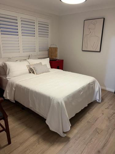 Ένα ή περισσότερα κρεβάτια σε δωμάτιο στο Ettalong Beach