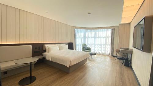 Ένα ή περισσότερα κρεβάτια σε δωμάτιο στο Hanting Hotel Shanghai Anting Subway Station