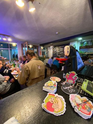 a bar with plates of food on a counter at Posada Los Olivos in Baños