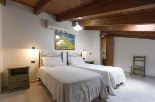 Ένα ή περισσότερα κρεβάτια σε δωμάτιο στο House and Apts in Alghero 27113