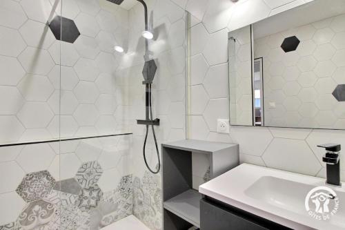 a bathroom with a shower and a sink at Cerillac in Questembert