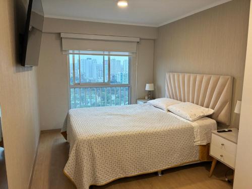 Un pat sau paturi într-o cameră la Exclusivo Departamento Vista Parque de las Aguas