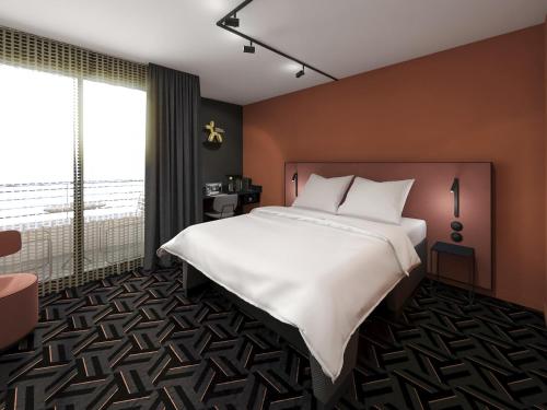 Ένα ή περισσότερα κρεβάτια σε δωμάτιο στο Tribe Carcassonne