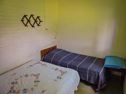 Ένα ή περισσότερα κρεβάτια σε δωμάτιο στο Pousada Sítio Paremi