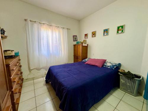 En eller flere senge i et værelse på Turística