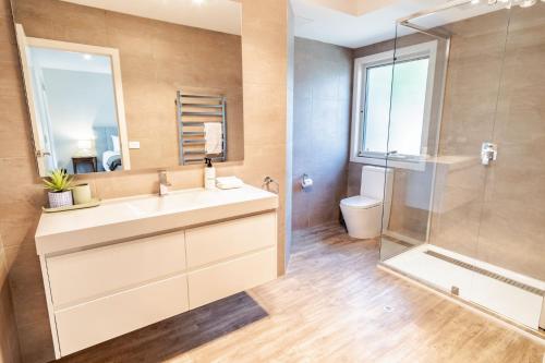 a bathroom with a sink and a shower at Amber Mist Villa - Two in Bright