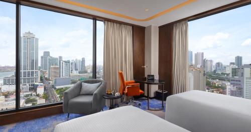 Postel nebo postele na pokoji v ubytování Amari Colombo, Sri Lanka